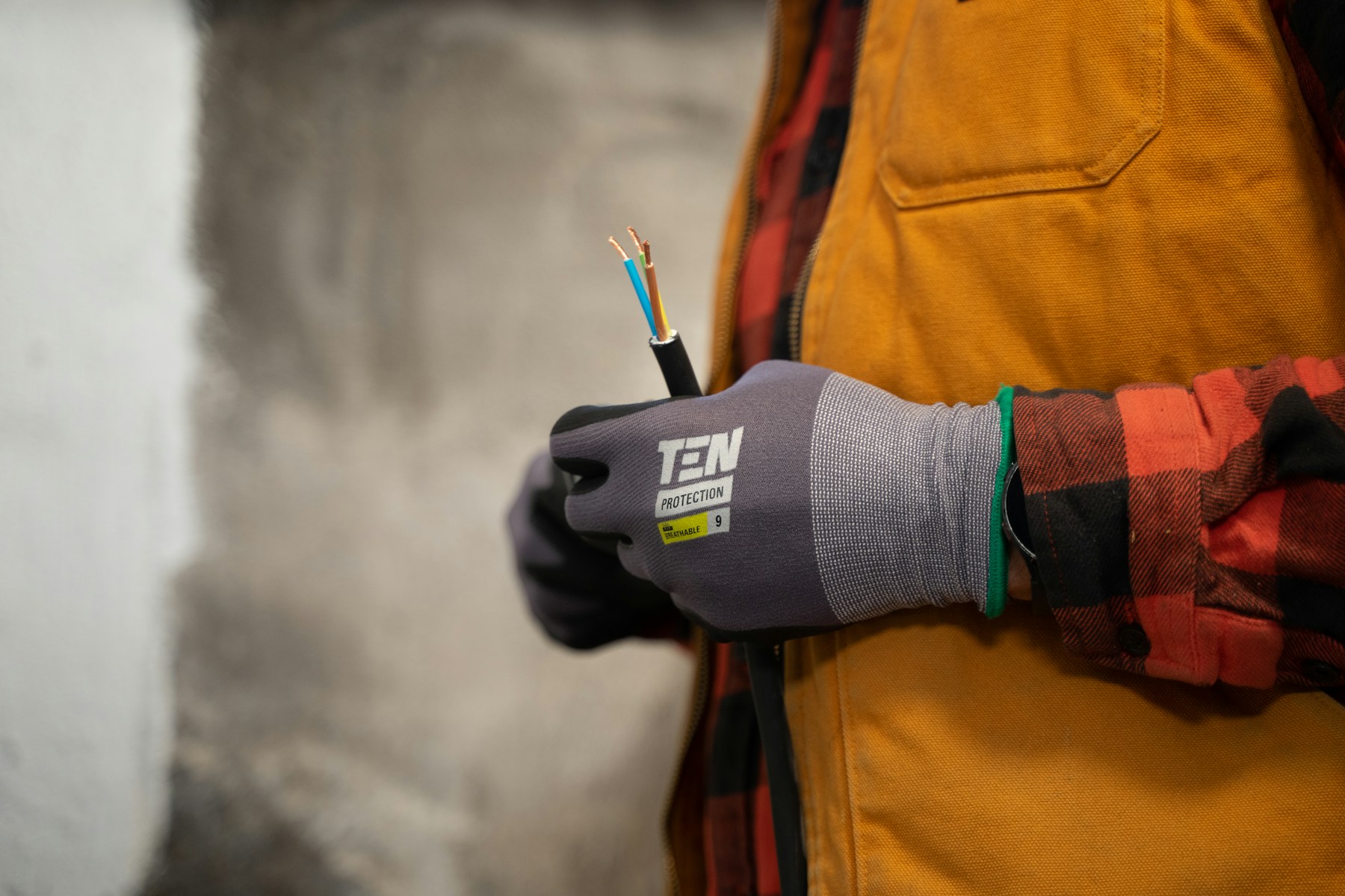 Illustrative electrical professional holding cable